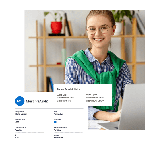 a girl wearing glasses and a green stole working on a laptop