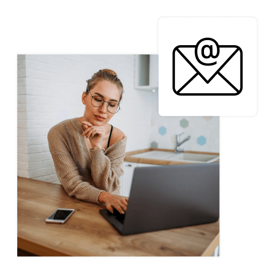 woman working on laptop testing email campaign